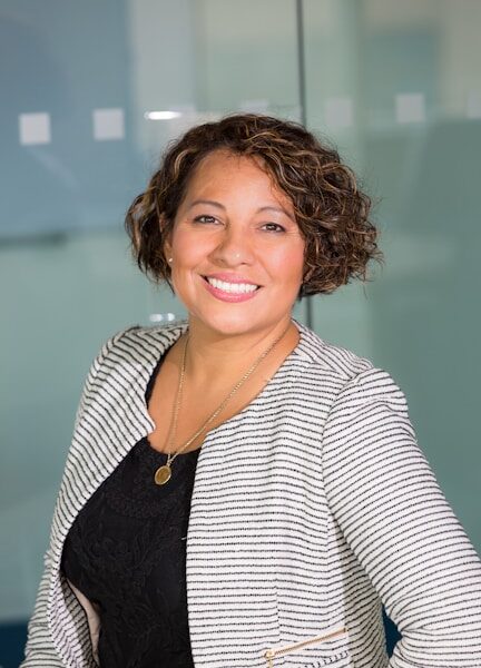 A businesswoman in an office smiling