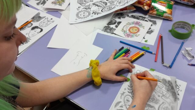 A display of tattoo art images as part of the Discover Your Future art workshop.