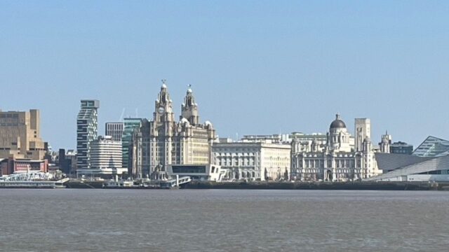 Liverpool waterfront, showing the Three Graces and the cityscape on the banks of the River Mersey.