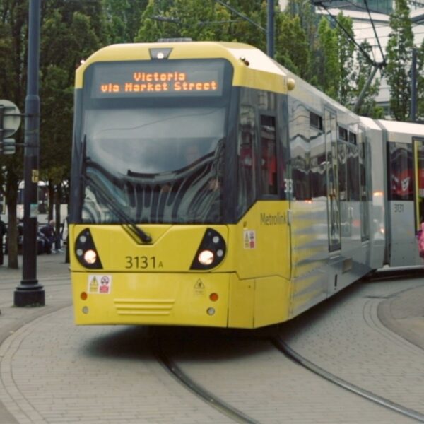 A photo of a yellow Manchester tram