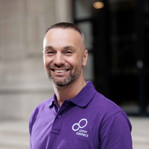 Product Manager Paul is pictured outside, smiling at the camera.