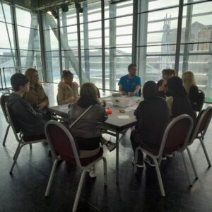 A group of young people taking part in a round-table discussion about the challenges they face and the way the Discover Your Future programme can help them.