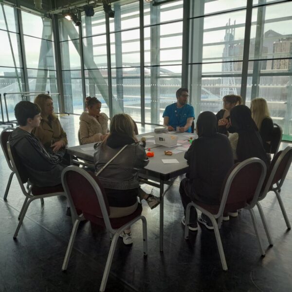 A group of young people taking part in a round-table discussion about the challenges they face.