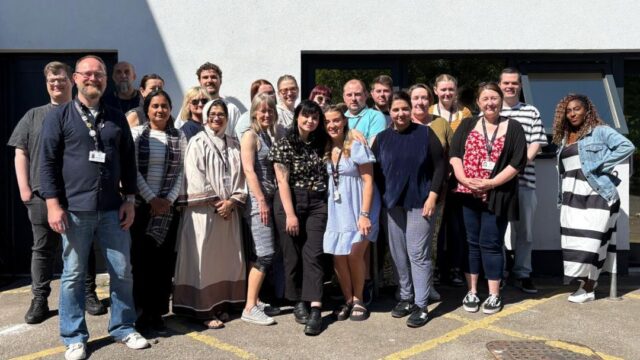 A team photo of the Career Connect Manchester team smiling