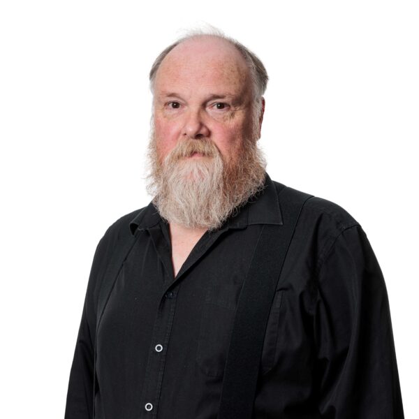 head and shoulders shot of Stewart Nicholson. He is wearing a black shirt.