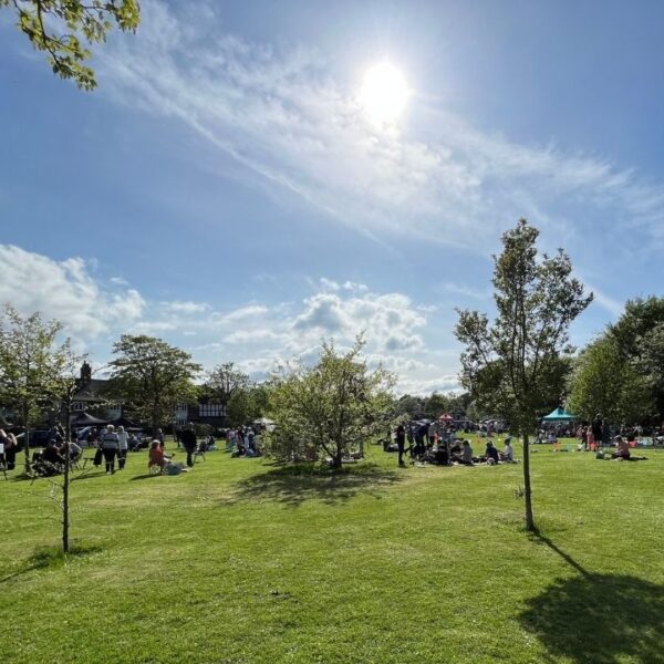 A park with people in on a sunny day