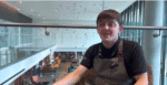 Youth ambassadors Josh is in a chair in his workplace (a hotel), explaining what it's like to be a youth Ambassador.
