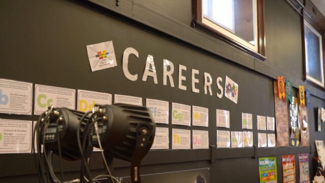 A school wall with information on careers