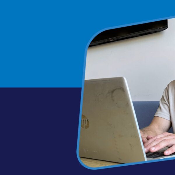 Banner featuring a picture of a young man using a laptop