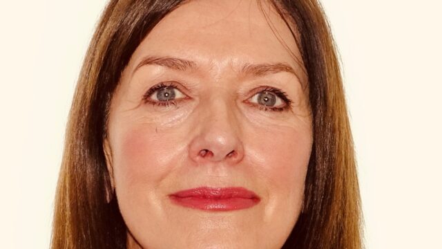 A headshot of Kath Wyke, Schools Quality Consultant at Career Connect. Kath has long dark hair and is smiling at the camera.