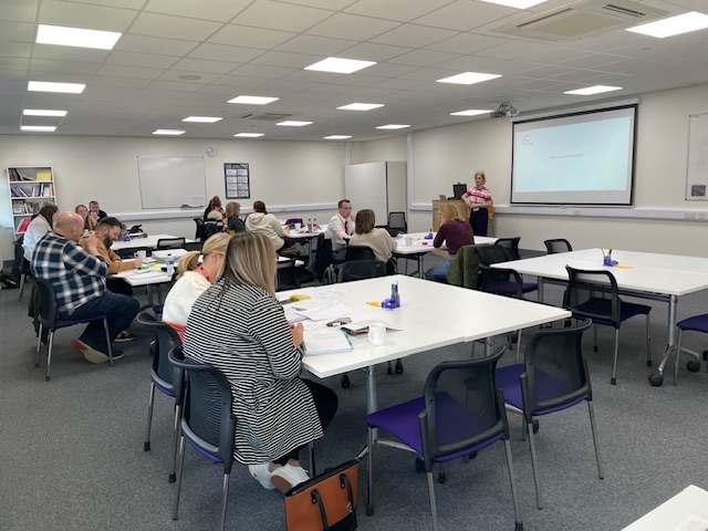 A group of people sat at tables at Lincolnshire Career Hub