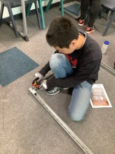 A young person taking part in an electrical engineering training activity.