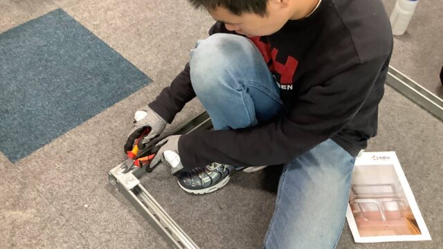 A young person taking part in an electrical engineering training activity.