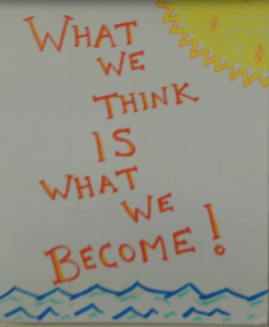A poster featuring the words "What we think is what we become!"