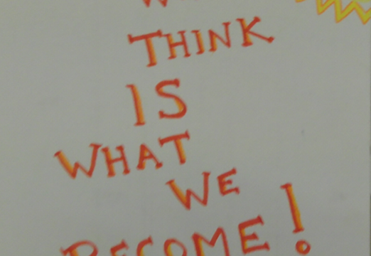 A poster featuring the words "What we think is what we become!"
