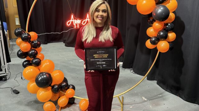 Olivia Moss, posing with her Apprentice of the Year Award.