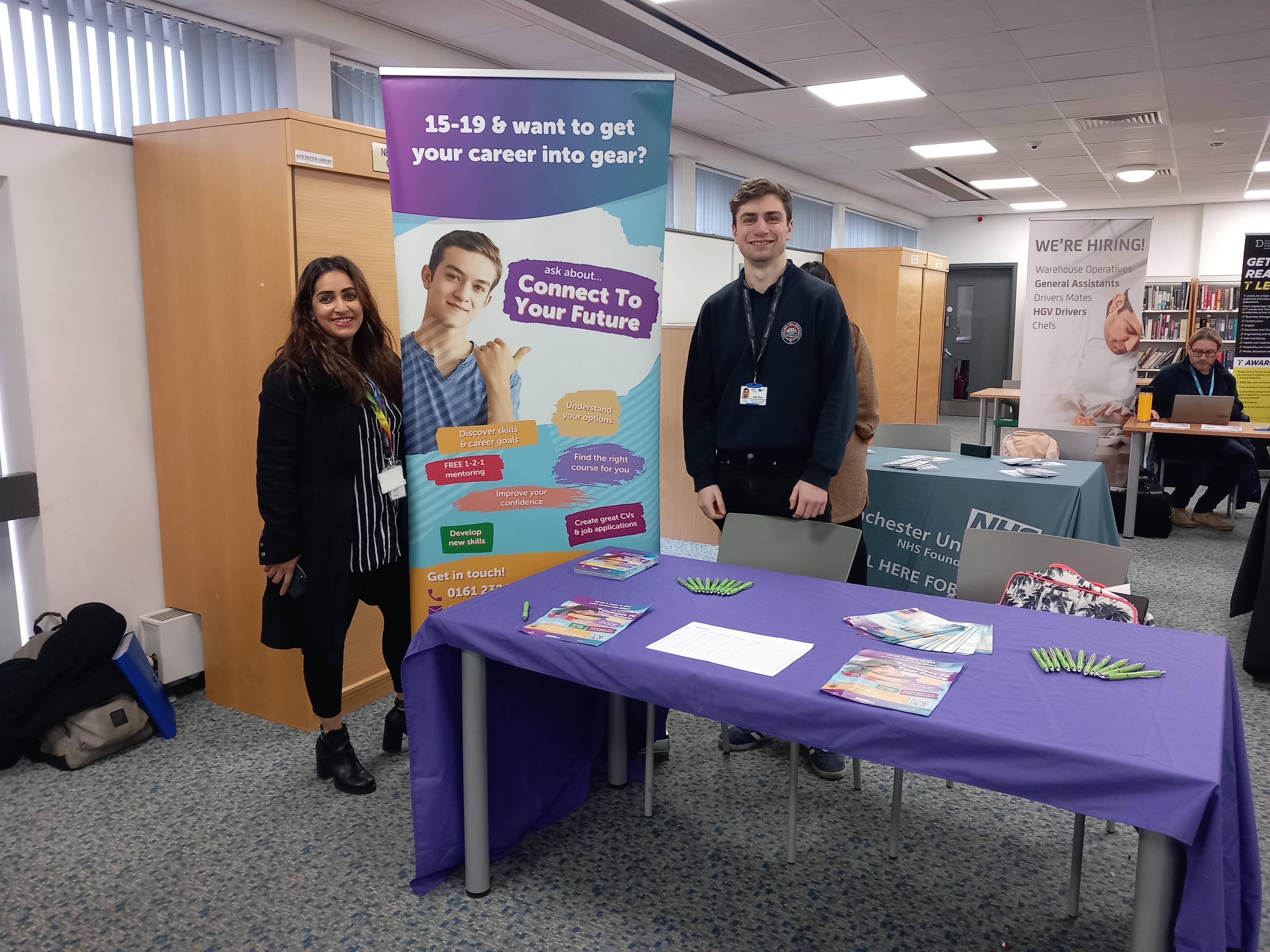 This image shows two careers advisers at a Connect To Your Future (CTYF) careers event.