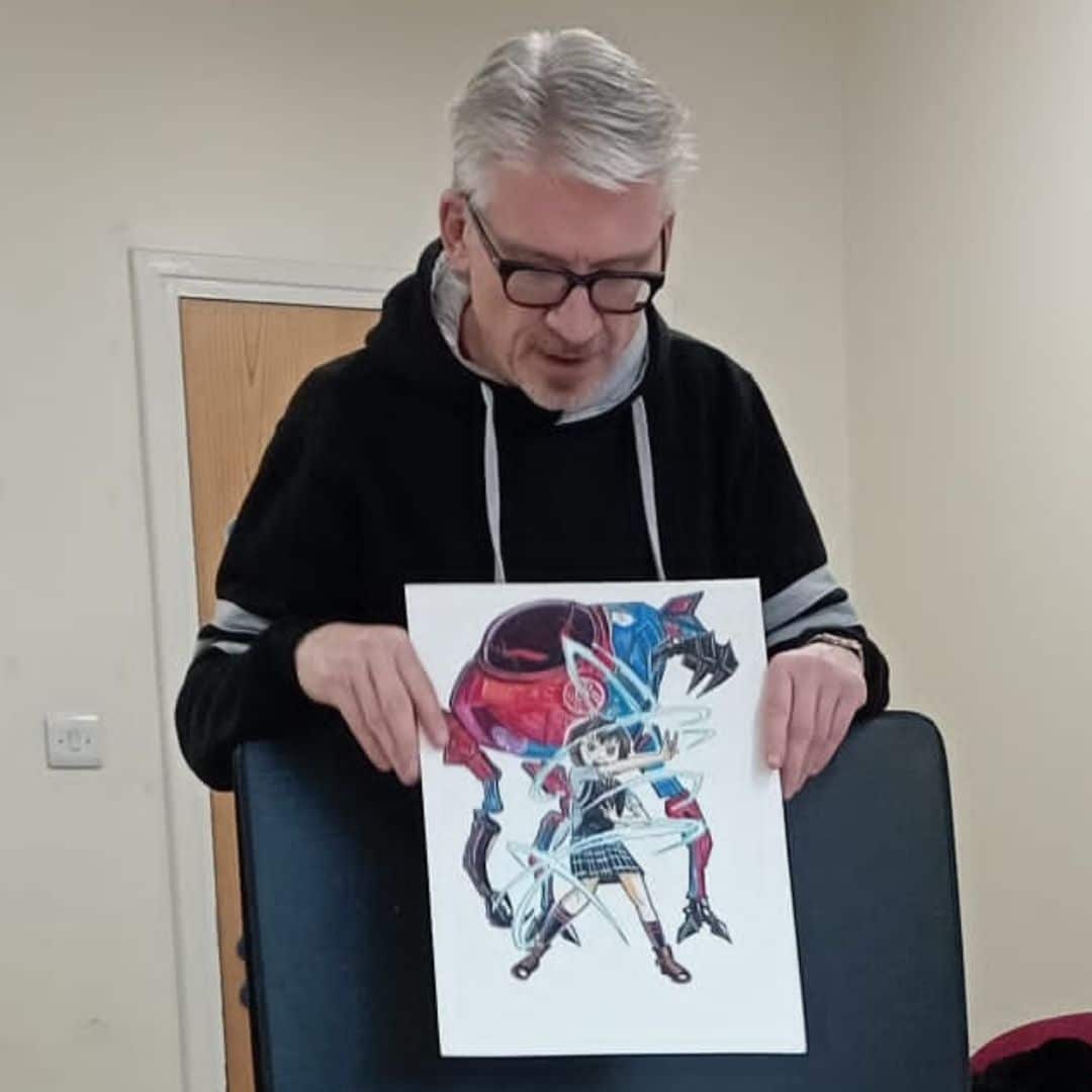 An image of local artist Paul Pickford delivering an interactive workshop on how to create Manga/Anime artwork, during the Discover Your Future programme.