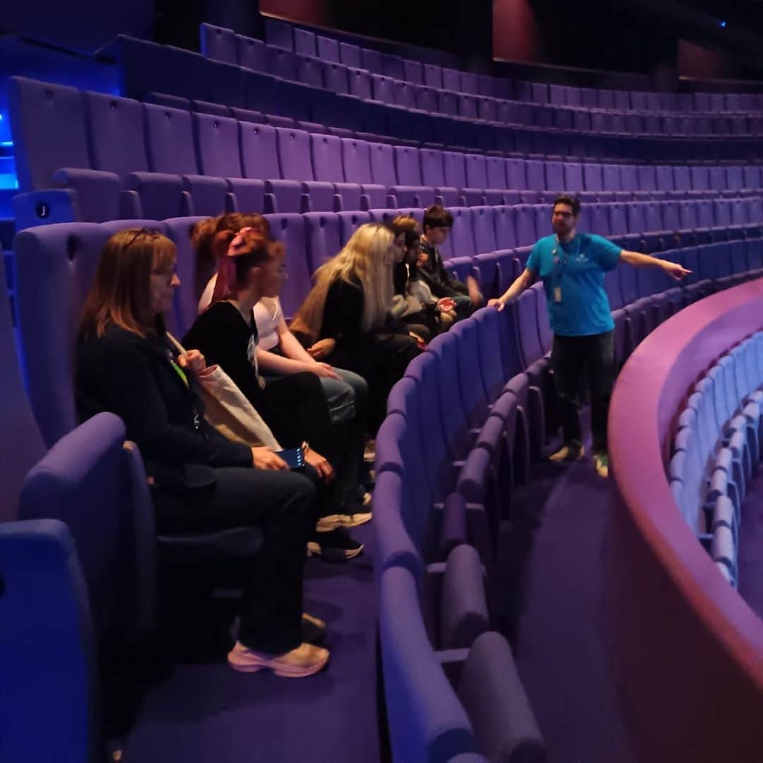 An image of young people sitting in the stalls at The Lowry theatre as part of the Discover Your Future programme.