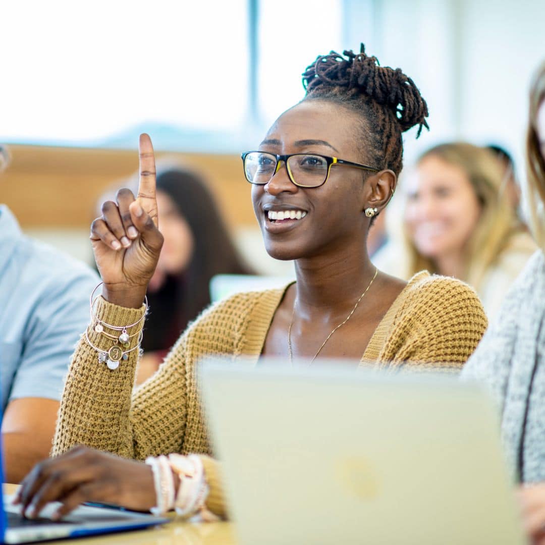 A black, female student in a classroom